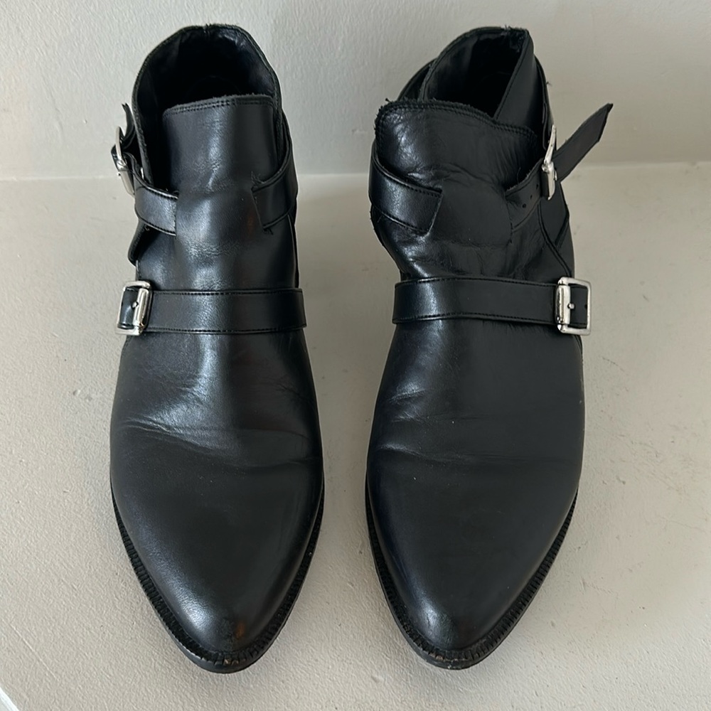 Black ankle boots with silver buckles